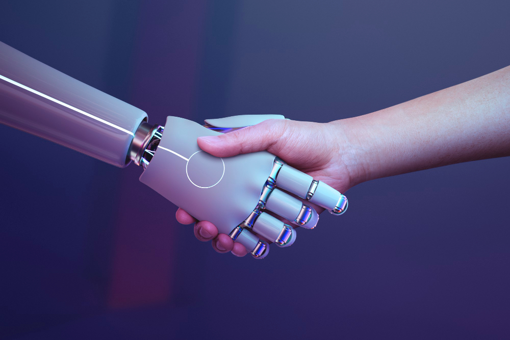 Premios Tecnología Social | FUNTESO, Fundación Tecnología Social imagen de la mano de un robot y de la mano de un humano estrchándose las mismas